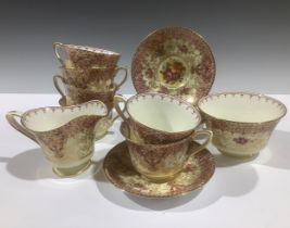 A Royal Worcester tea service for six, printed and painted with colourful flowers on a cream ground,