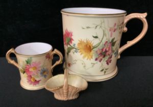 A large Royal Worcester blush ivory cup, decorated with wildflowers, 11cm high, crown and circle