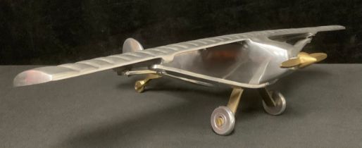 An aluminium desk model of Charles Lindbergh's Spirit of St. Louis monoplane in which he made the