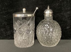 A Victorian silver mounted globular clear glass sugar caster, the domed pierced cover with finial,