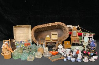 Toys & Juvenalia - an early 20th century wicker work dolls crib on rocker; a Staryacht pond yacht; a