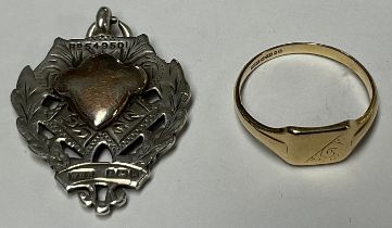 A 9ct gold signet ring, 1.8g; a silver fob medal, Birmingham 1909 (2)