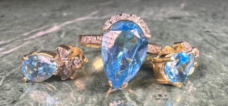 An aquamarine and diamond ring and earrings