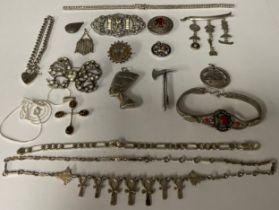 A quantity of silver and white metal jewellery, including brooches, bracelets, necklaces, etc (