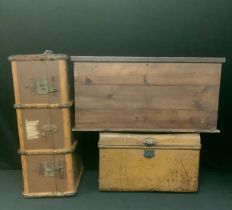 A metal trunk, hinged, domed cover; a travel trunk; a stained pine carpenter's box, hinged cover,