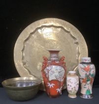 A Chinese brass bowl, engraved with dragons and ships, 25cm diameter; a Persian style circular tray,