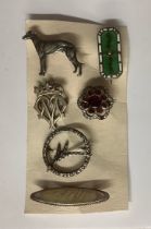 Jewellery - a collection of six brooches, including a Victorian enamel brooch, an Arts and Crafts