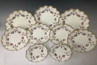 A set of three Royal Crown Derby shaped circular Royal Antoinette pattern dinner plates, second