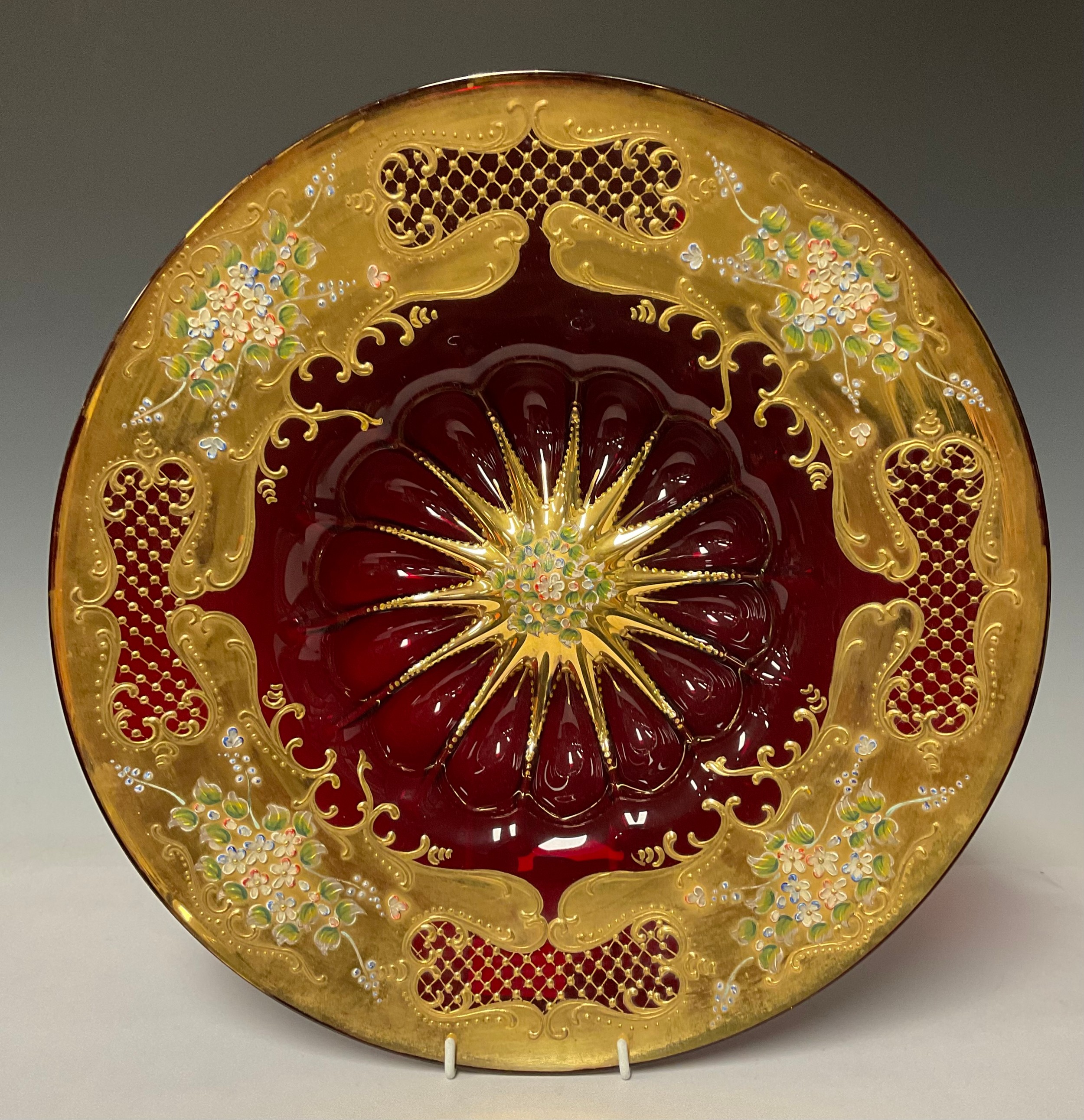 A Murano ruby glass decanter and six wine glasses, gilded and painted with flowers in relief; a - Image 2 of 2