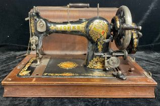 A Jones hand cranked sewing machine, serial number 270930, early 20th century