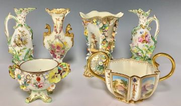 A pair of early 19th century Coalport Coalbrookdale type vases or jugs, painted with birds and