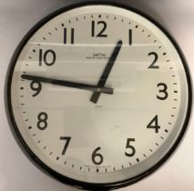 Clocks - A large Smith's electric wall clock, white face, black Arabic numerals, Made in Great