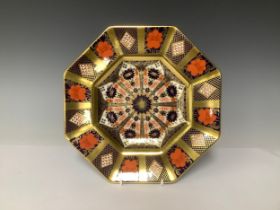 A Royal Crown Derby Imari palette 1128 pattern hexagonal plate, solid gold band, 22cm wide,