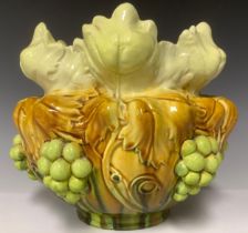 A Bretby Art Pottery jardinière, moulded in high relief with a continuous band of fruiting vine,