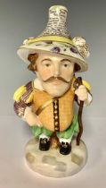 A Royal Crown Derby Mansion House dwarf, richly attired in 17th century cavalier costume,