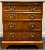 A George I style amboyna bachelors chest, quarter veneered top outline with boxwood stringing, the