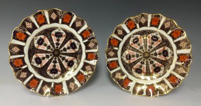 A pair of Royal Crown derby Imari palette 1128 pattern shaped circular plates, 21cm diameter,