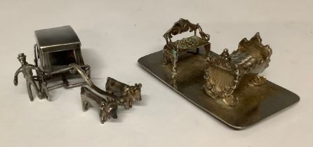 Boxes & Objects - an ornate steel Art Nouveau miniature sofa and crib; a miniature ox-drawn sled and