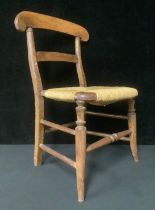 A late 19th century child's rush seat chair, 61cm