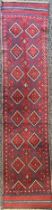 Oriental Carpets - a hand knotted woollen Meshwani runner, 258cm x 58cm