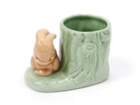 A Hornsea pottery spill vase, of small proportions, in the form of a rabbit beside a tree stump, 6.