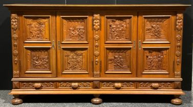 A large Continental oak enclosed housekeeper’s linen cupboard or side cabinet, oversailing