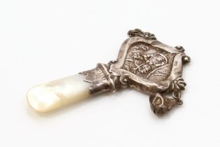 A George V silver and mother of pearl baby's teething rattle, 7.5cm long, Birmingham 1918