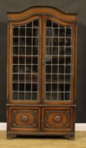 A Jacobean Revival oak bookcase, 194cm high, 103cm wide, 38cm deep, c.1935