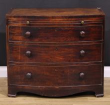 A George III mahogany bowfront bachelor’s chest, caddy top above a slide and three long graduated