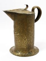 A large Arts and Crafts brass water jug, by William Soutter and Sons, riveted construction, the