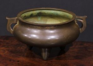 A Chinese bronze tripod ding censer, scroll handles, 22cm wide, 19th century