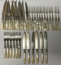 A set of Edwardian silver tea knives and forks, to serve twelve, the silver blades chased and