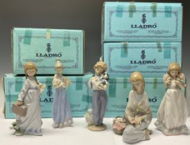 A Lladro figure, Flower Song, 7607, boxed; others, My Buddy, 7609, boxed; School Days, 7604,