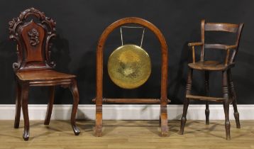 A Victorian oak framed dinner gong, 85.5cm high, the gong 33.5cm diameter; a Victorian mahogany hall