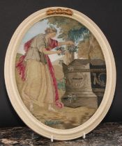 A George III needlework picture, Fame at the tomb of Shakespeare, after Angelica Kauffman, oval,