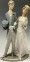 A Lladro figure group, Wedding Day, number 1404, designed by Juan Huerta, 31.5cm, printed and