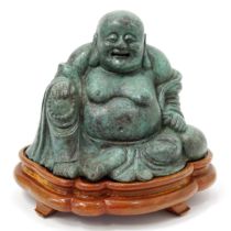 Chinese School, a verdigris patinated bronze, of Budai, seated, 23cm high, wooden stand