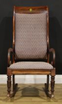 A 19th century mahogany rocking chair, 106.5cm high, 56cm wide, the seat 48cm wide and 42cm deep