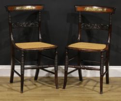 A pair of Post-Regency beech and brass marquetry side chairs, each with a cane seat, ring-turned
