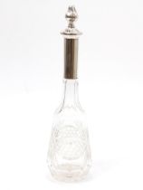 A continental silver mounted cut glass decanter, star-cut base, 32cm high, the mount marked 800