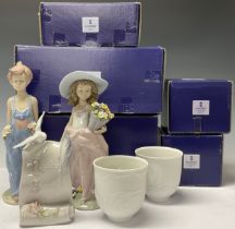 A Lladro figure, A Wish Come True, 7676, Annual Figure 1999, boxed; another, Pocketful of Wishes,