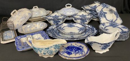 A Staffordshire Adams and Co. Tedworth pattern flow blue part dinner service, including sauce tureen