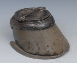 A 19th century silver coloured metal mounted horses hoof table snuff and cover, faults, 17cm wide