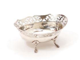 An EPNS bon bon dish, pierced border, scroll feet, 13cm wide