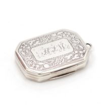 A George III silver lozenge shaped vinaigrette, hinged cover enclosing a gilt interior with