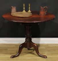 A George III mahogany tripod supper table, circular top, turned baluster pillar, cabriole legs,