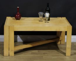 A mid-20th century design American beech and oak expanding coffee table, in the manner of John
