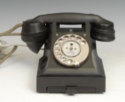 A black Bakelite GPO dial-up telephone