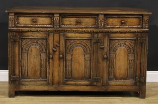 A 17th century style oak low dresser or side cabinet, by Titchmarsh & Goodwin, 84cm high, 137cm