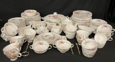 A Royal Doulton Arcadia pattern tea and dinner service, transfer printed with summer flowers,